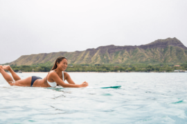 Surfer in front of Diamondhead